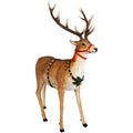 A decorative stag or deer figurine with large antlers, dressed in a holiday harness with gold bells, a red ribbon, and green holly accents, shown on a plain white background.