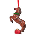 Horse ornament with a wreath and gift box on a white background