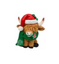 A Highland cow figurine wearing a red Santa hat with white trim and a green glittery scarf with a small red ornament, set against a plain white background.