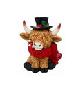A Highland cow figurine wearing a black top hat with a green and red holly accent, a red knit scarf, and black boots, set against a plain white background.