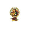 A circular Christmas nativity wall hanging with a gold-toned frame, featuring an illustration of Mary, Joseph, baby Jesus, and a sheep, mounted on a small decorative base with red ribbon and greenery.