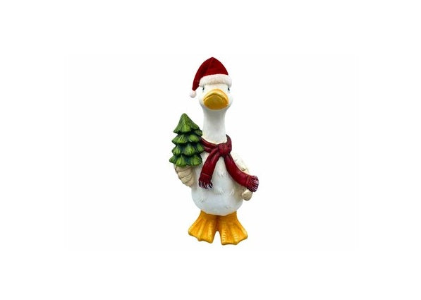 A small white goose figurine wearing a red Santa hat and red scarf, holding a green Christmas tree, on a plain white background.
